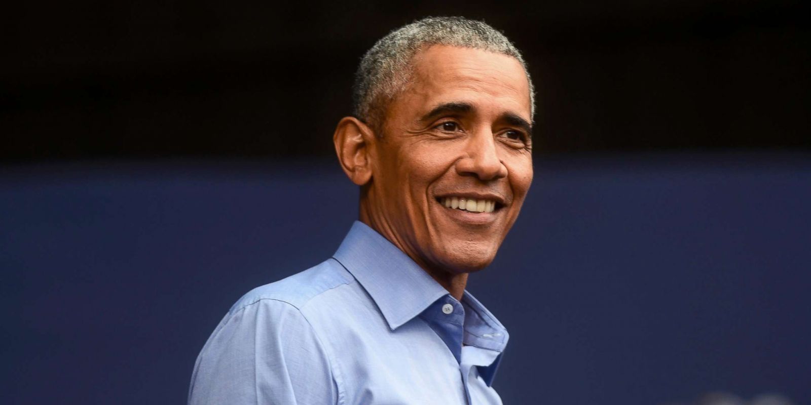 Barack Obama looks on while speaking onstage 