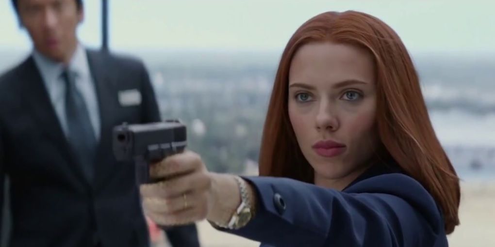 Natasha holds a gun on Alexander Pierce in Captain America Winter Soldier