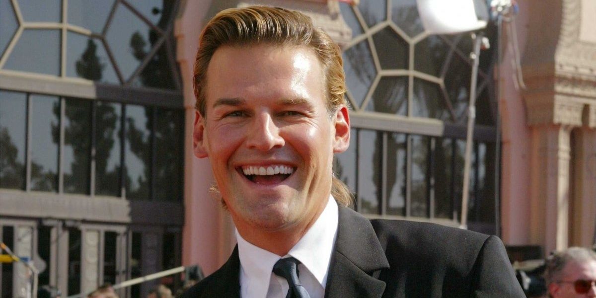 Brian Heidik from Survivor smiling and wearing a suit.
