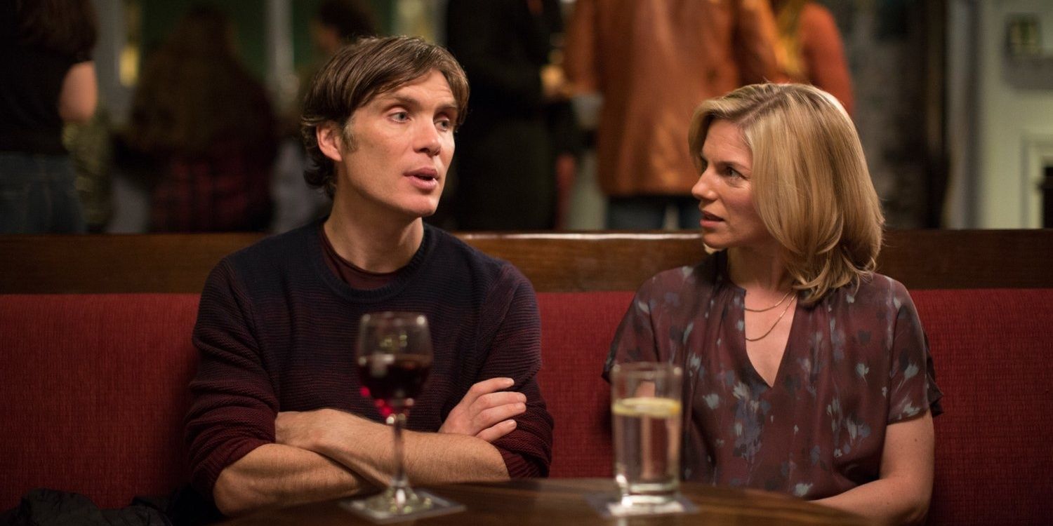 Cillian Murphy's character in The Delinquent Season sits at a table beside a woman