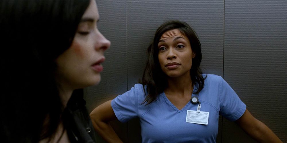 Claire Temple stands in an elevator with Jessica Jones in Marvel Netflix