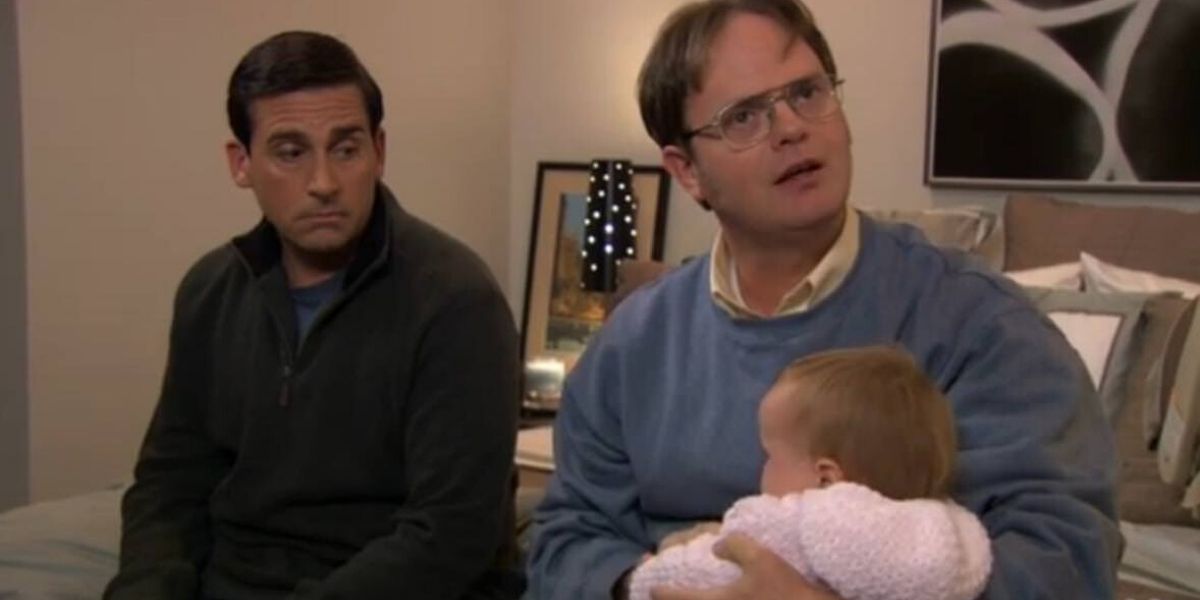 Dwight holding Cece next to Michael in The Office