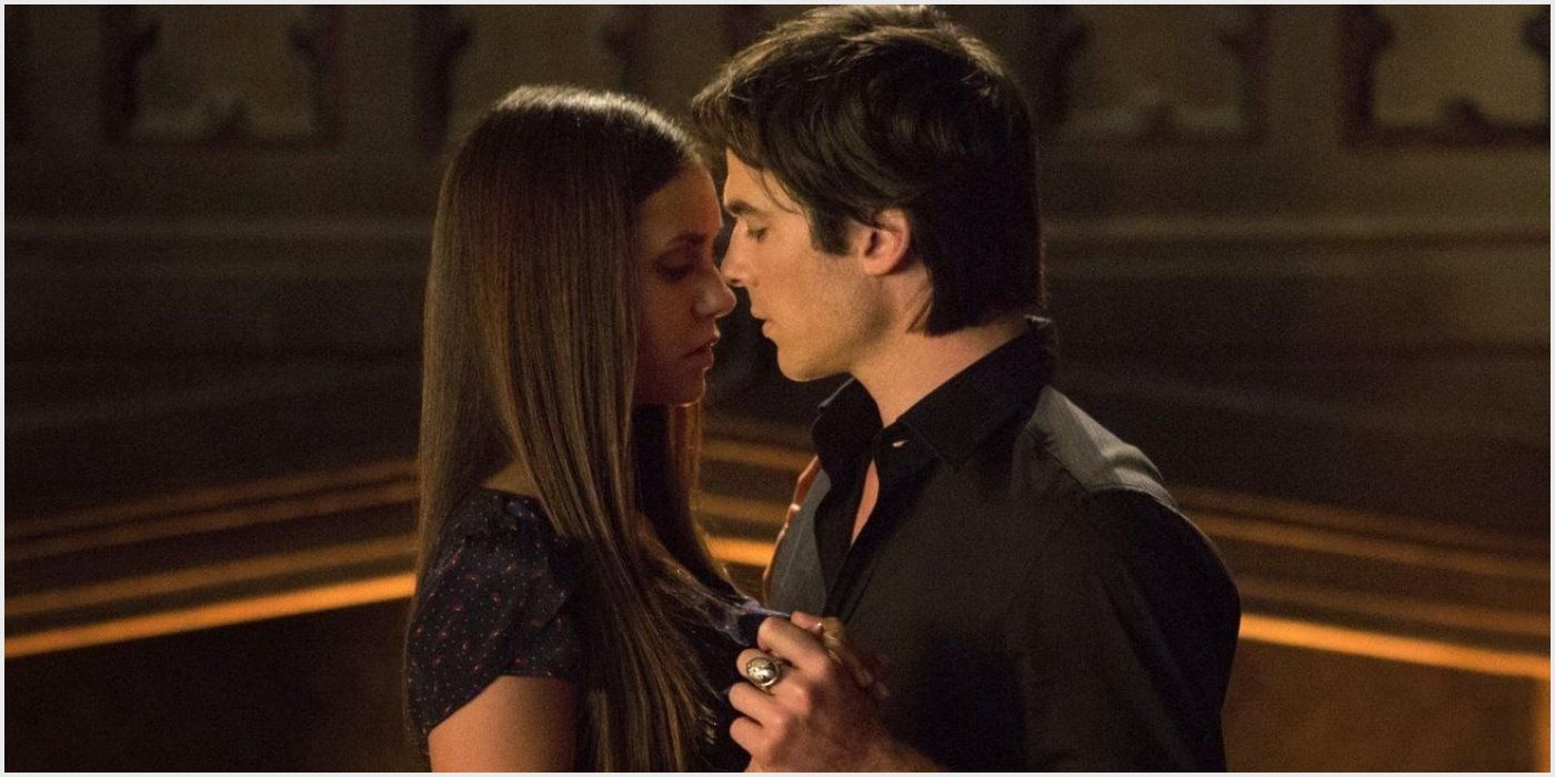 Damon and Elena share a close dance in The Vampire Diaries.