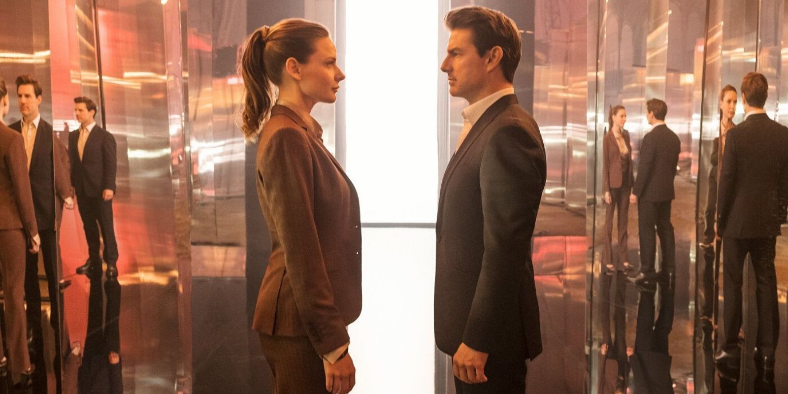 Ilsa Faust and Ethan Hunt stand face-to-face in Mission Impossible: Fallout