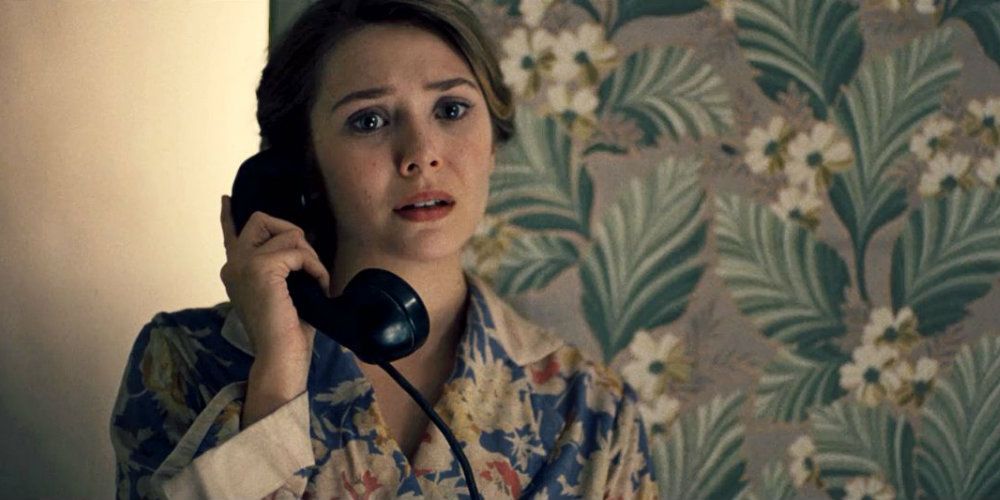 Elizabeth Olsen talking on the phone in Kill Your Darlings