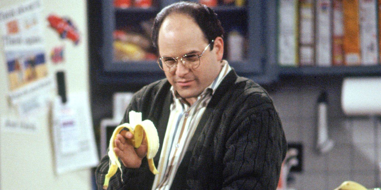 George eating a banana in Jerry's kitchen