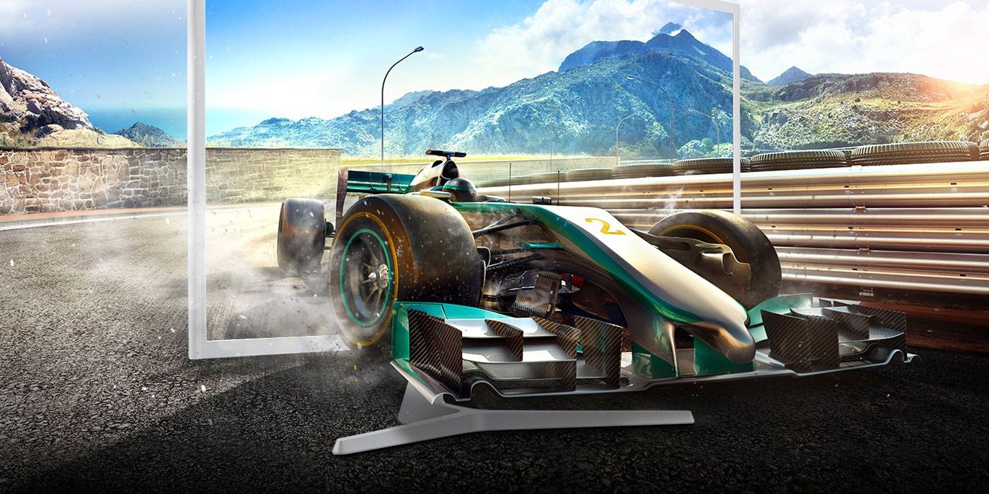 An image of a video game race car leaping out of a computer monitor