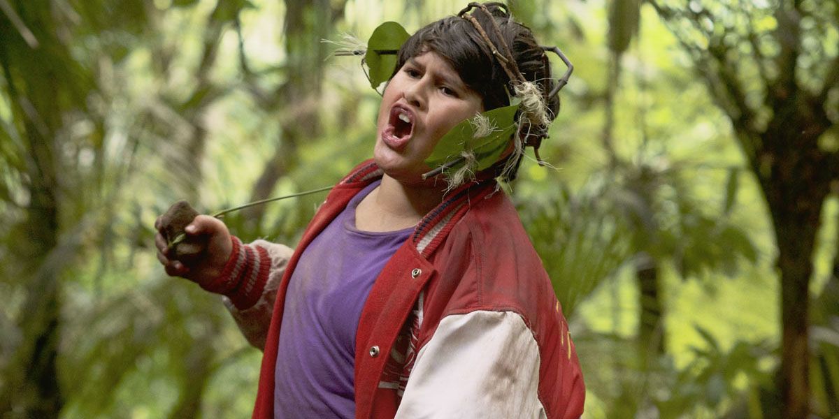 Julian Dennison dancing in the wilderness with a leaf headdress in Hunt for the Wilderpeople