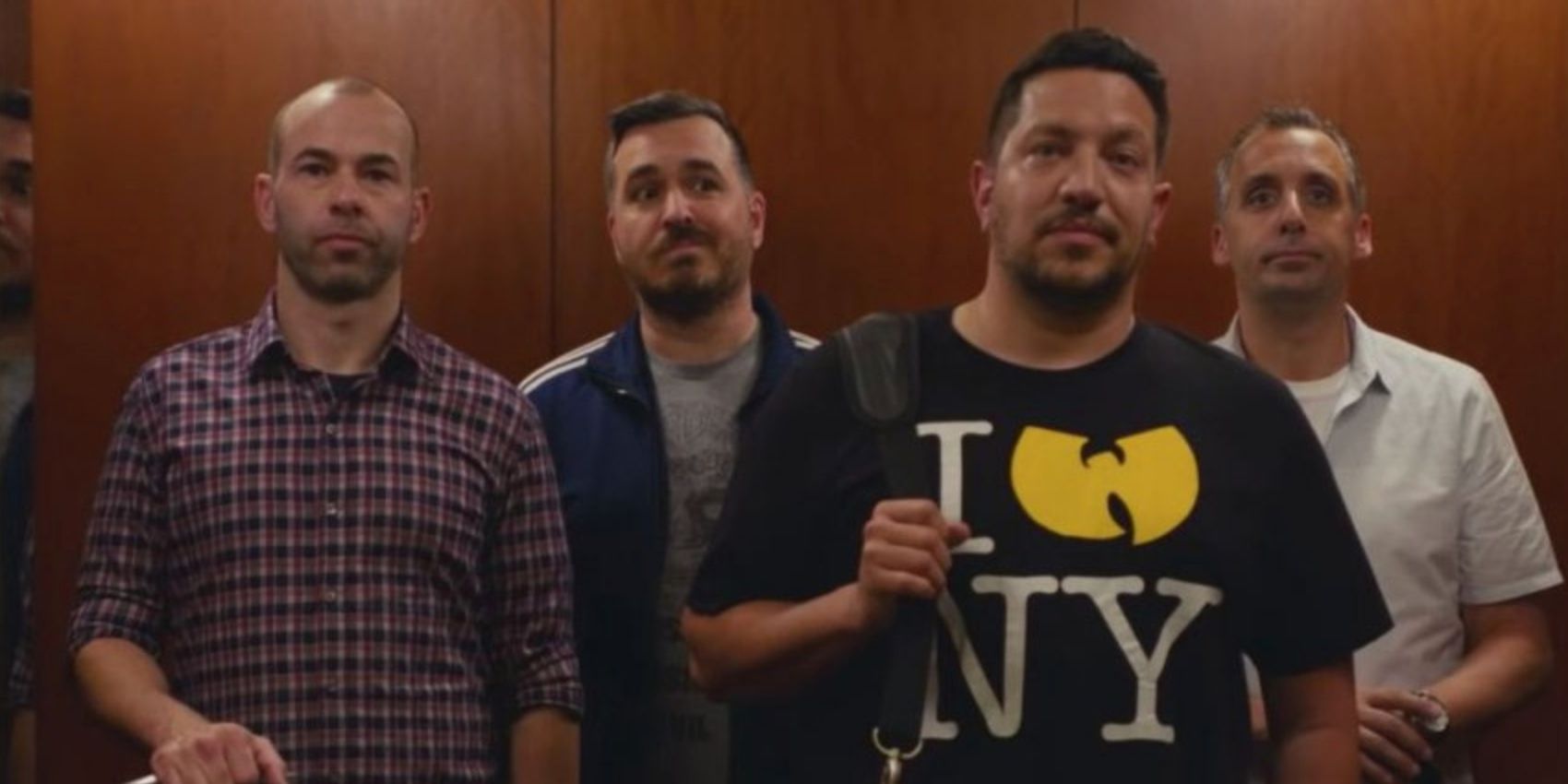 The cast of the Impractical Jokers movie in an elevator