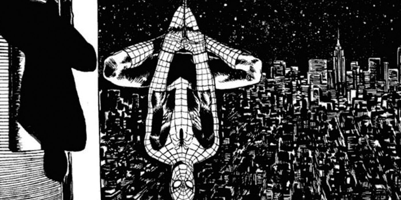 Spider-Man hanging upside down in black and white.