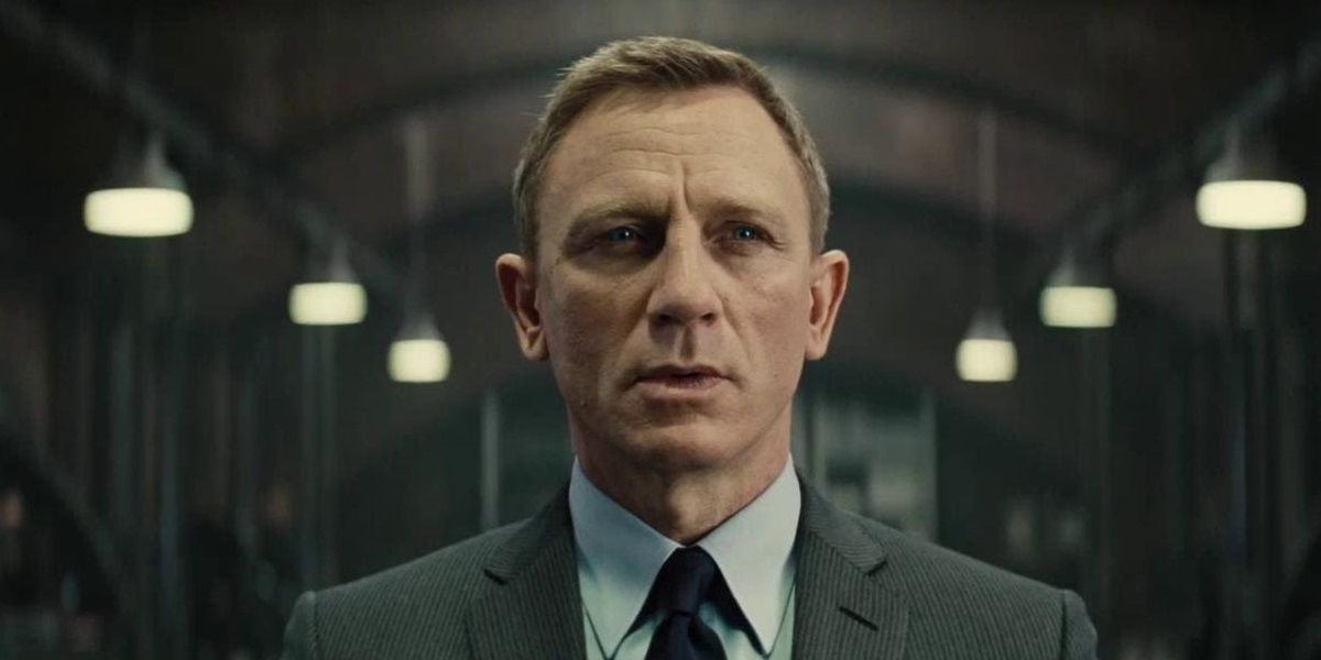 James Bond stands in a hallway in Skyfall