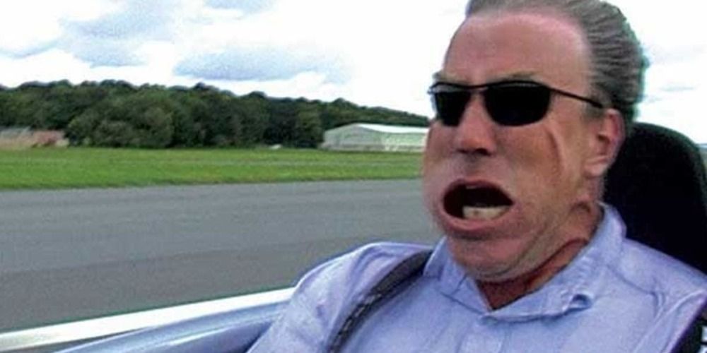 Jeremy Clarkson with his face blown back on the track on Top Gear