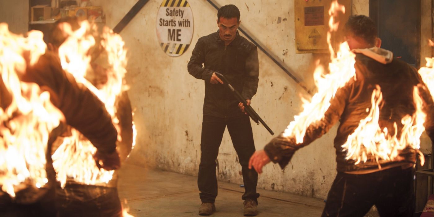 Joe Taslim faces two burning men in The Night Comes for Us