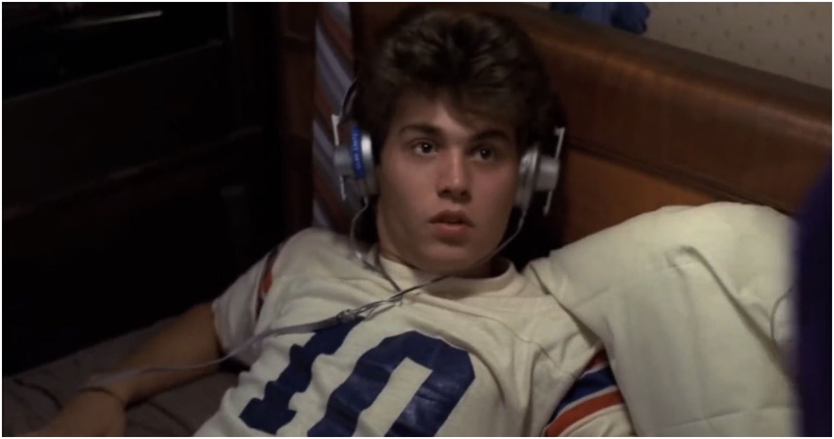 Johnny Depp terrified in bed with headphones on
