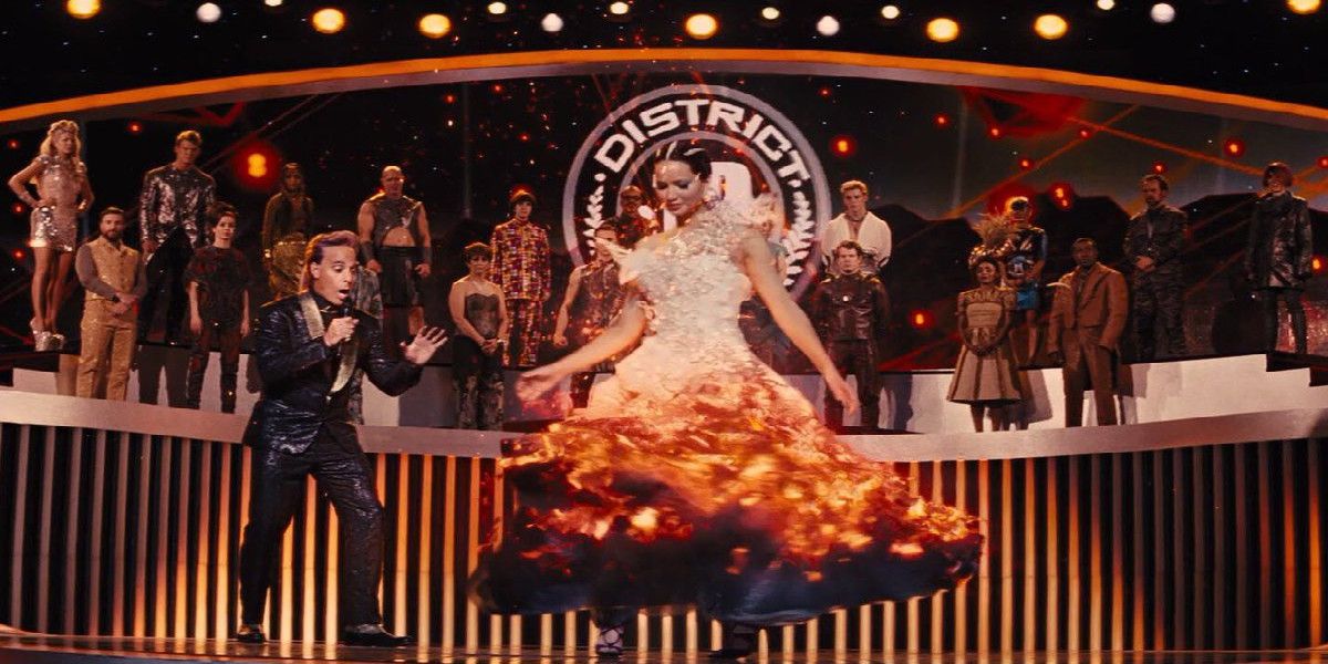 Katniss spinning on stage in a flaming dress from The Hunger Games