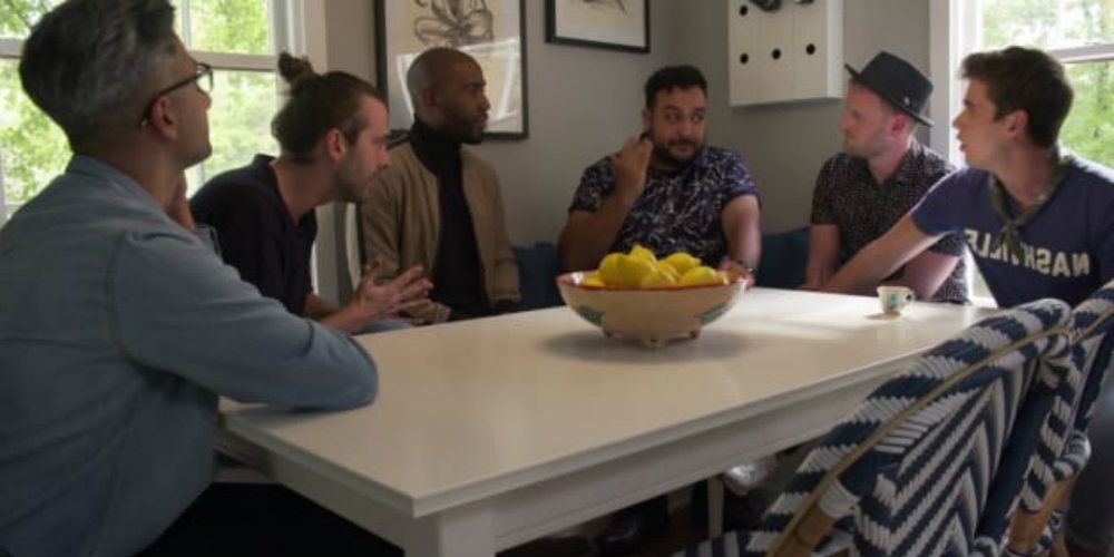 Leo Queer Eye sitting at table with fab five