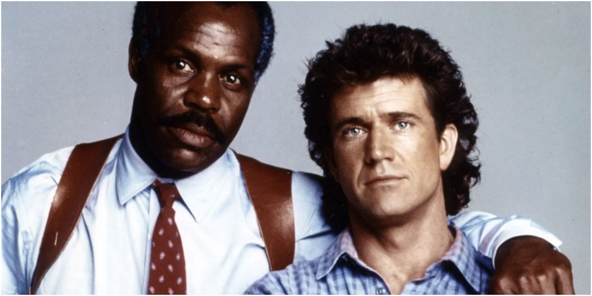 Mel Gibson and Danny Glover pose for a promotional image from Lethal Weapon 