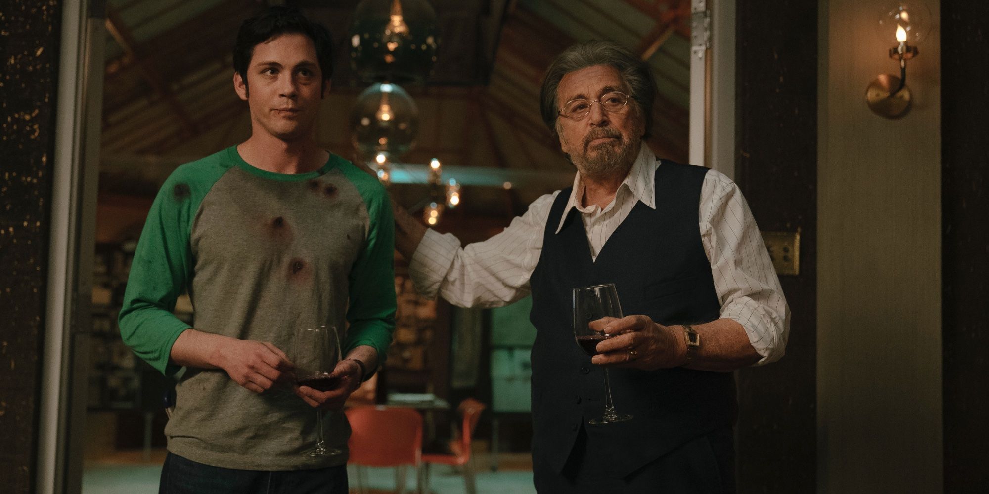 Logan Lerman and Al Pacino drink wine in Hunters on Amazon Prime Video