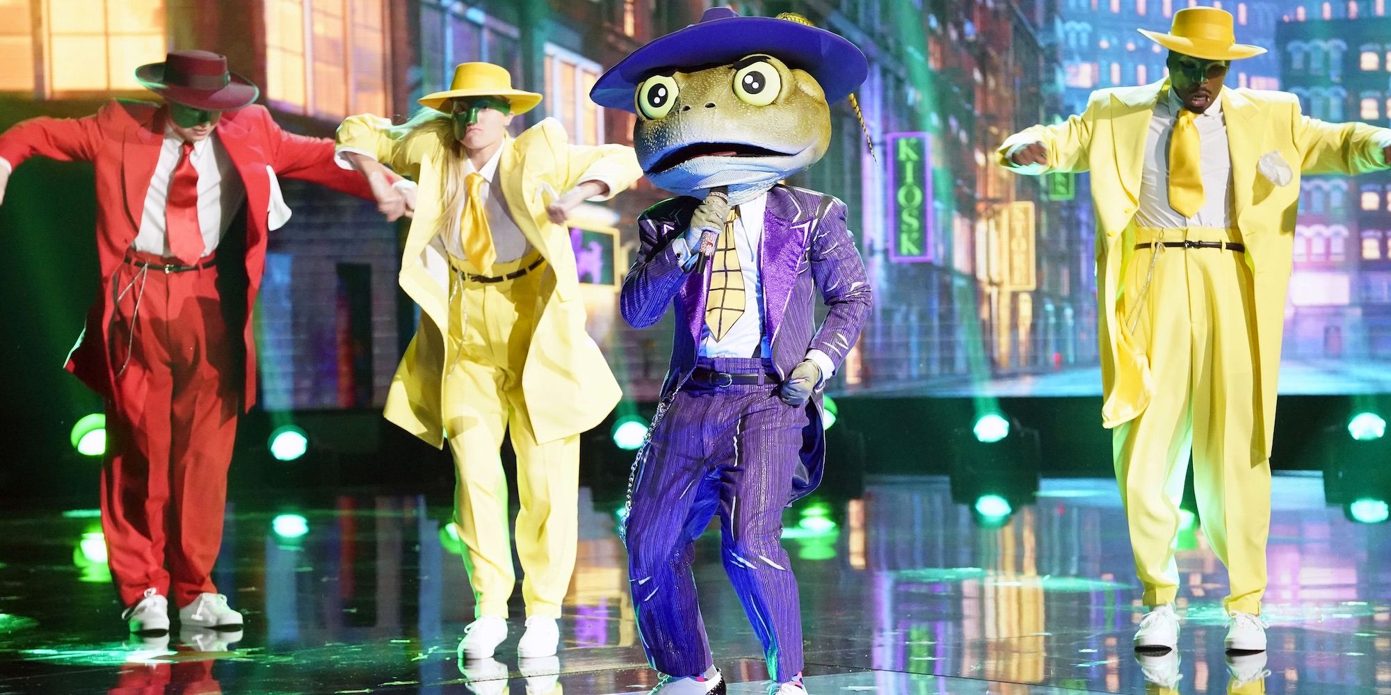 Masked singer season 3 frog on stage with backup dancers