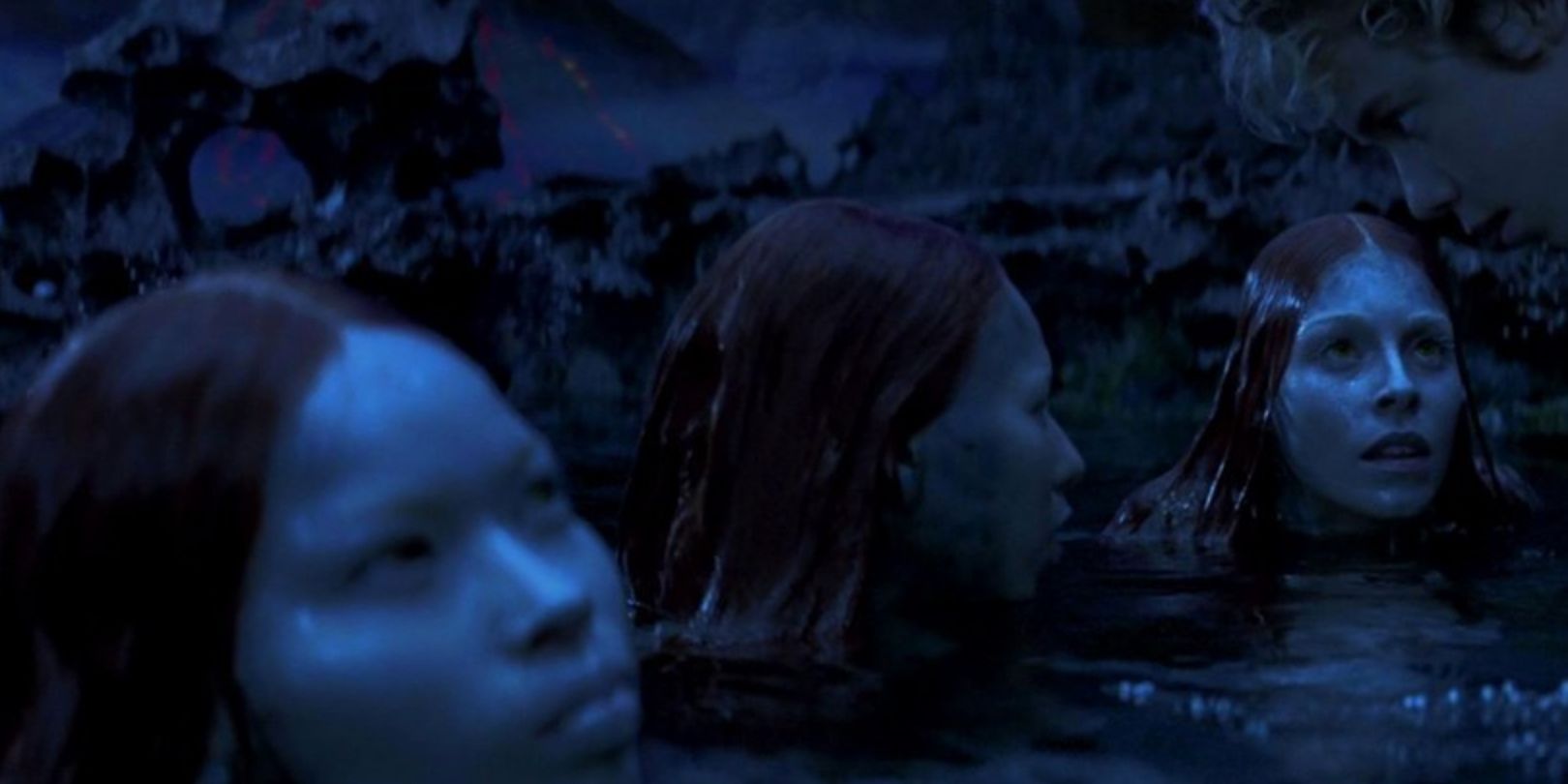 Mermaids with half of their bodies submerged underwater in Peter Pan 2003