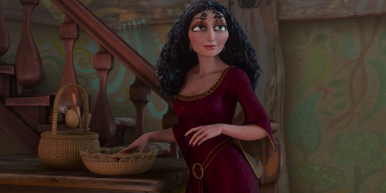 Mother Gothel stands on the stairs in Tangled