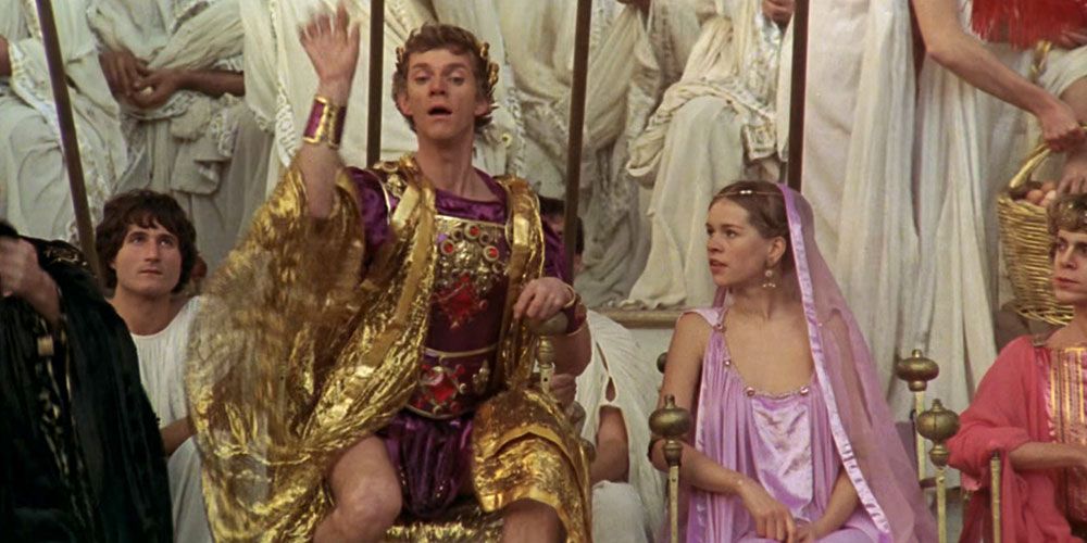 Caligula and a woman in the middle of a crowd in Caligula.