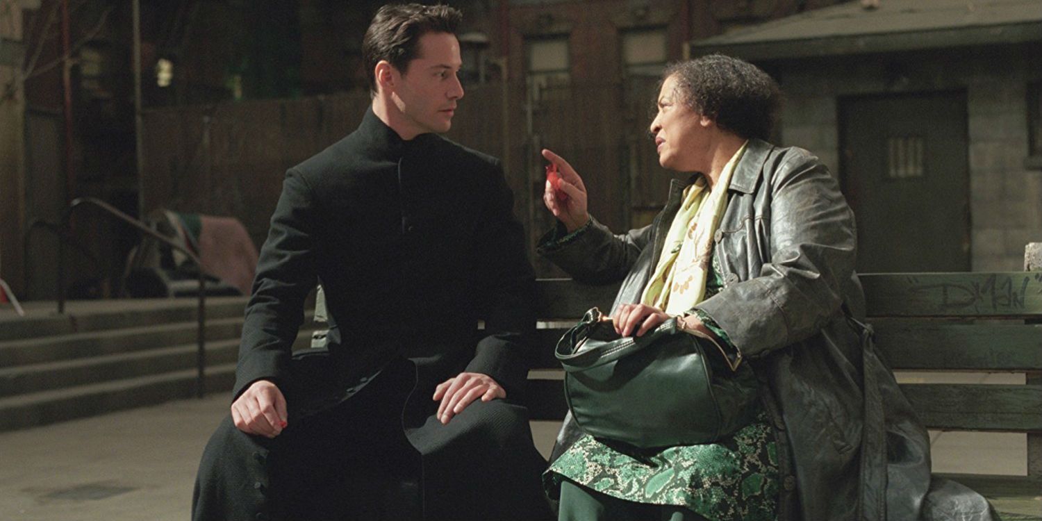 Neo and The Oracle talk on a bench in The Matrix Reloaded