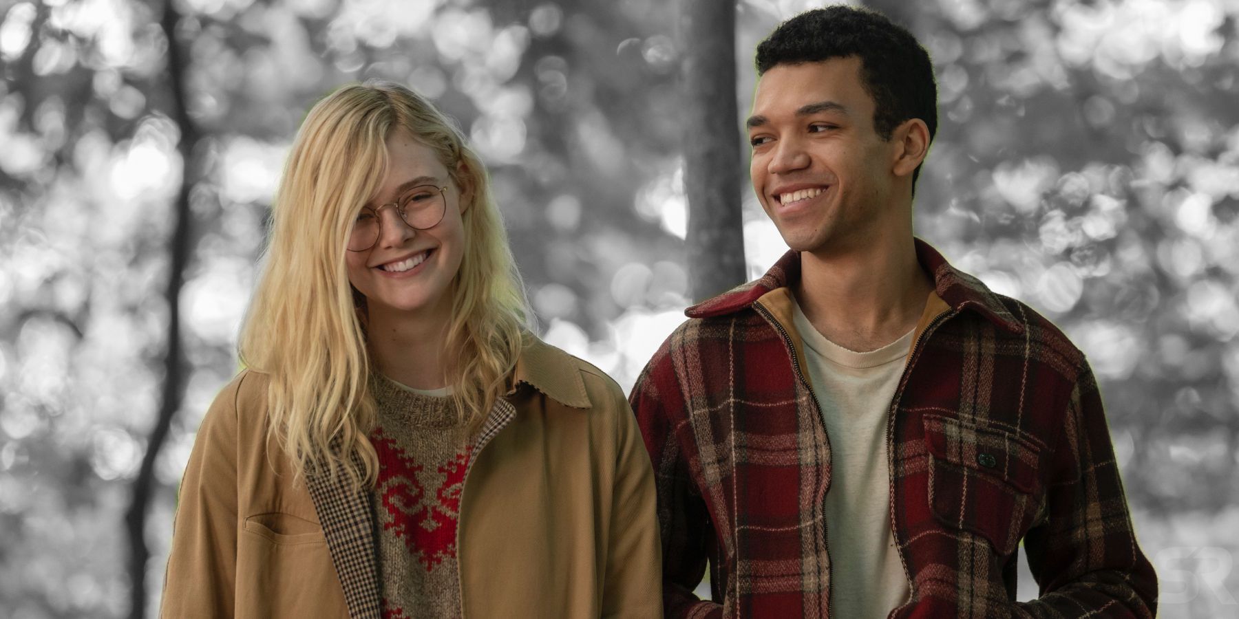 Elle Fanning and Justice Smith smiling and looking at each other in All The Bright Places