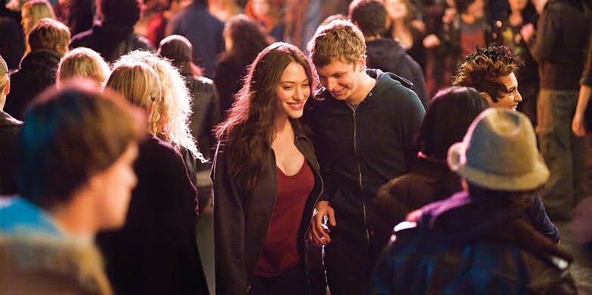 Kat Dennings and Michael Cera walking among a crowd in a still from Nick and Norah's Infinite Playlist
