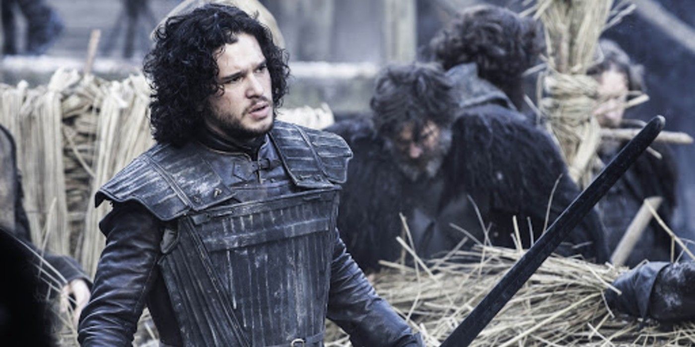 Jon Snow holds a sword at Castle Black in Game of Thrones