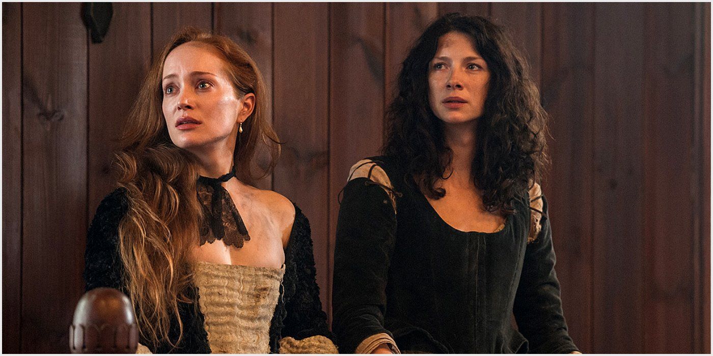 Geillis and Claire on trial in Outlander. Both women look scared