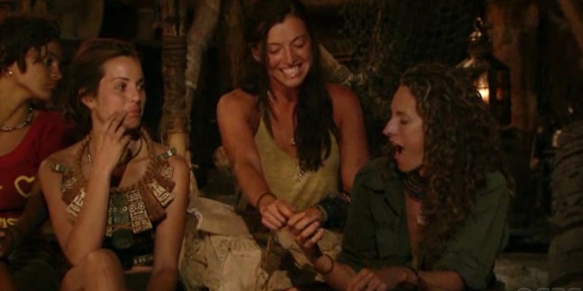 Parvati giving an idol to Jerri at tribal council