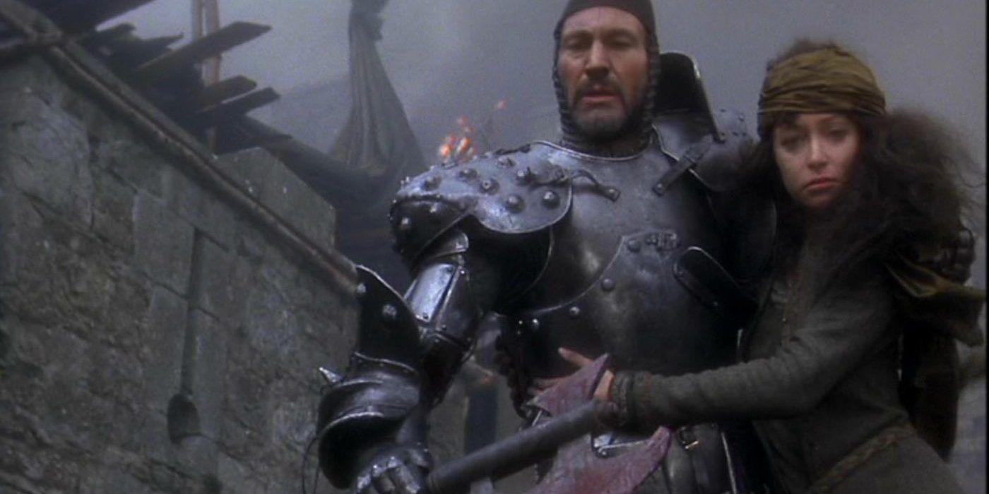 King Arthur carries a woman in battle in Excalibur