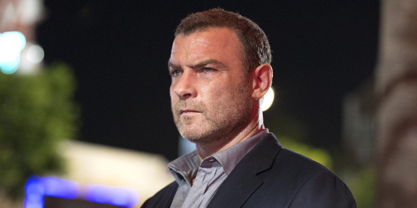 Ray Donovan standing outside, looking angry.