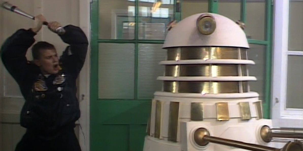 A person hitting the Dalek with a bat in Doctor Who