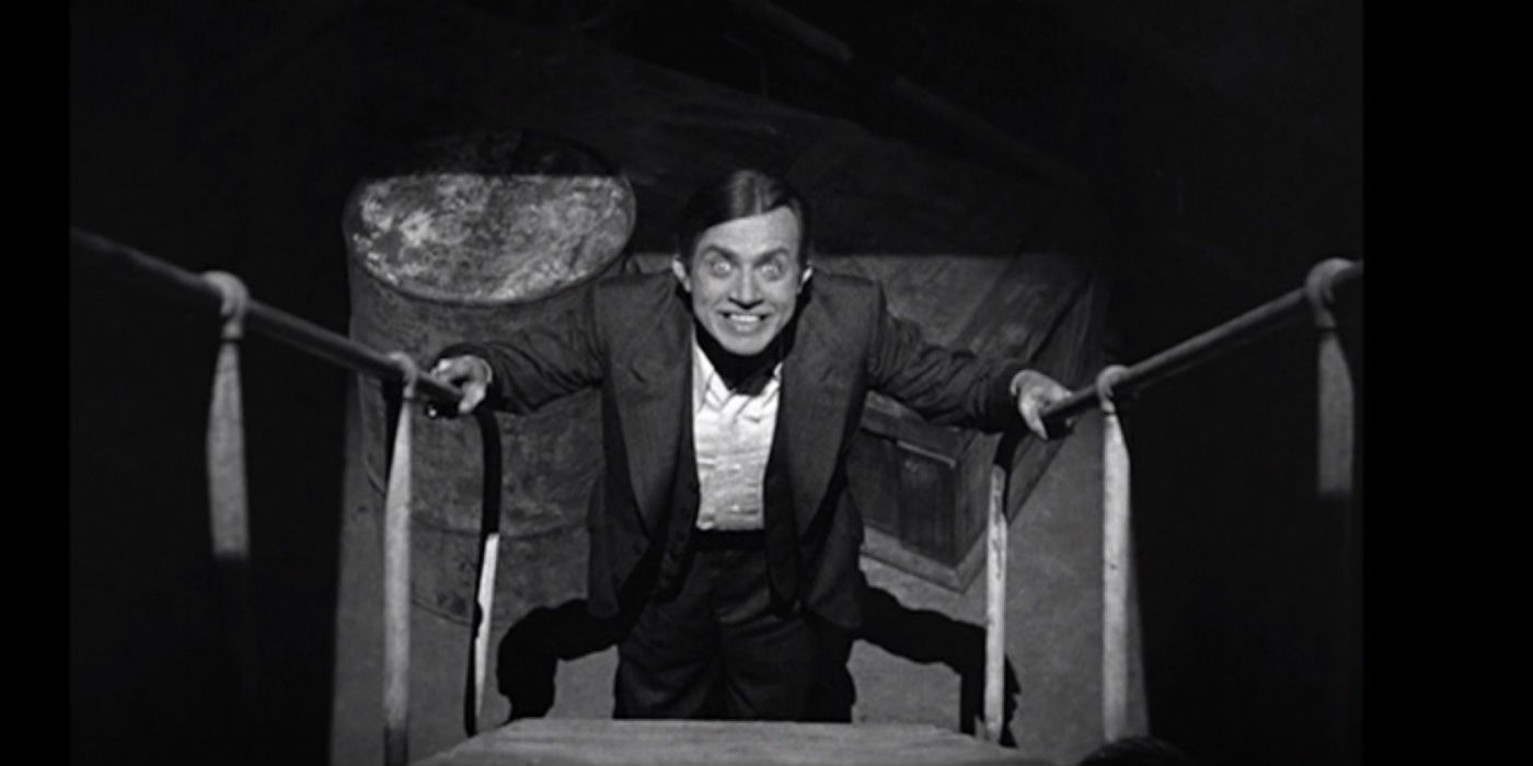 Renfield from Dracula walking up stairs