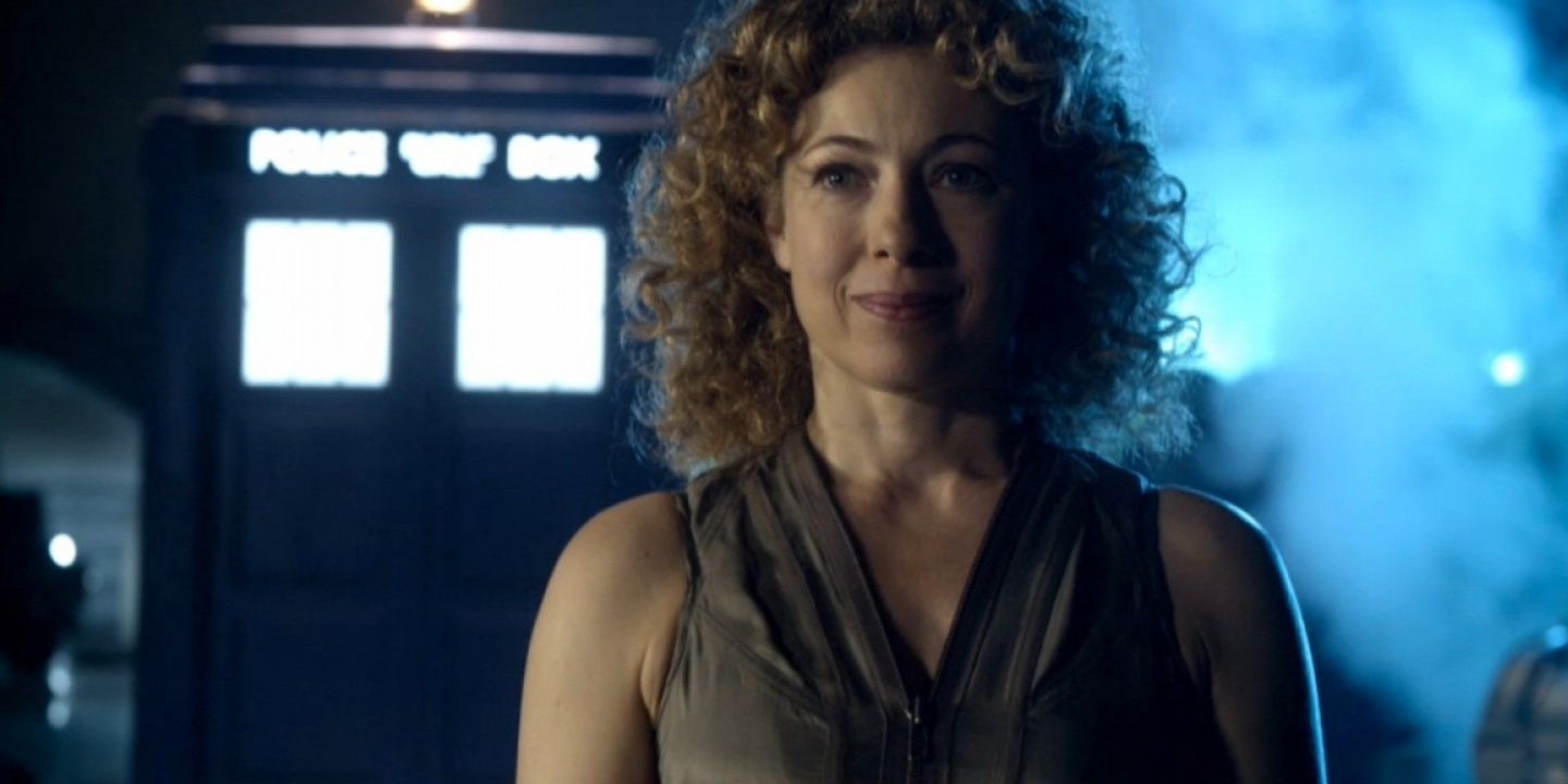 An image of River Song standing in front of a TARDIS in Doctor Who