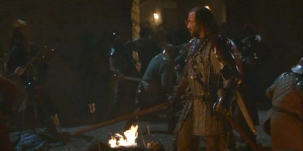 The Hound walking in firelight