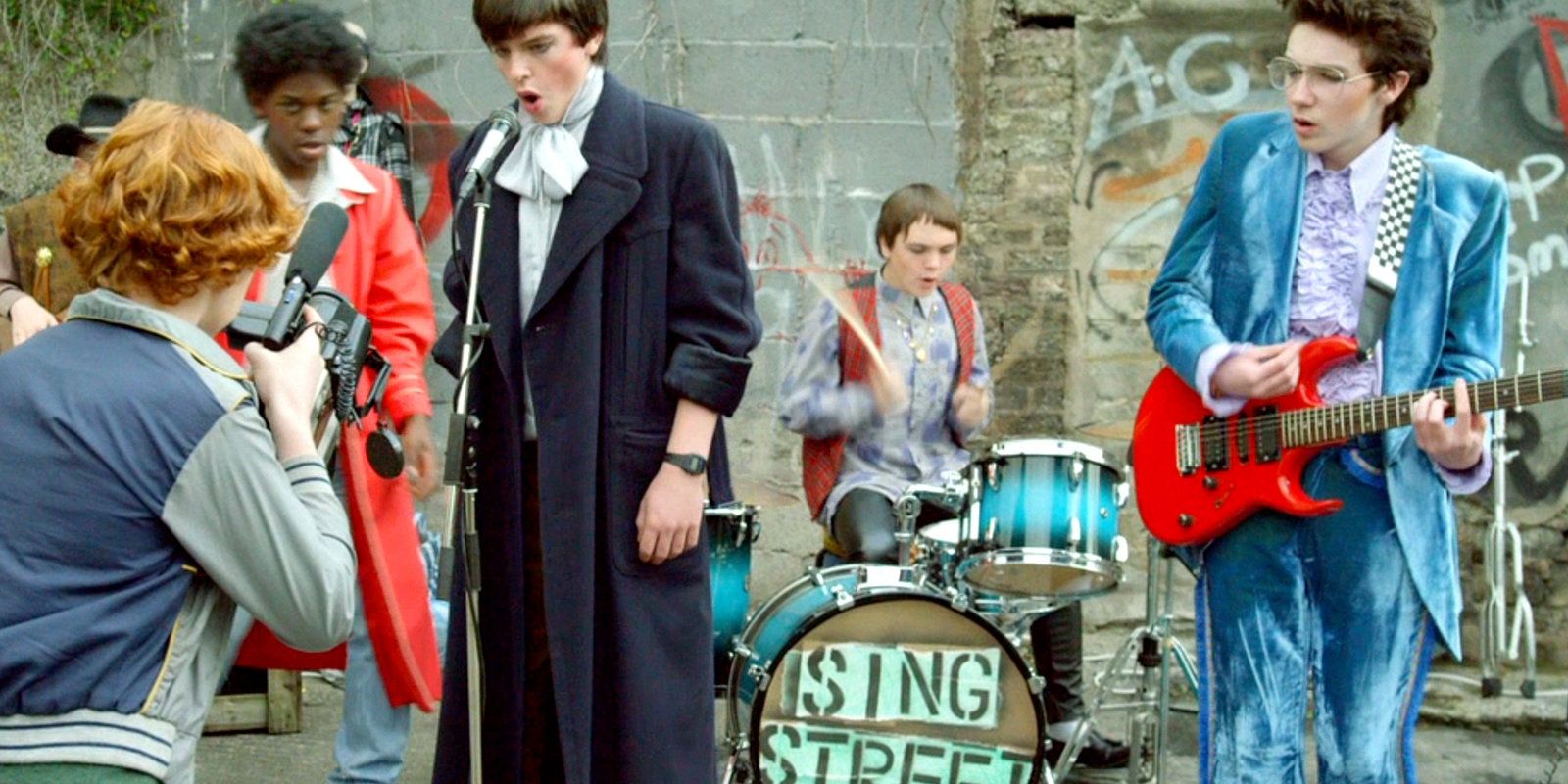 The band records a music video dressed in 80s outfits in Sing Street