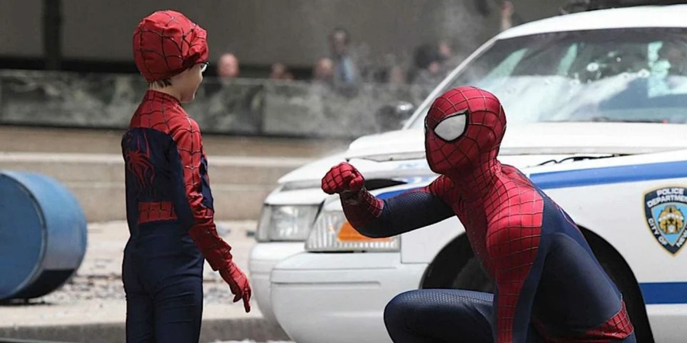 Spider-Man helping a little kid.
