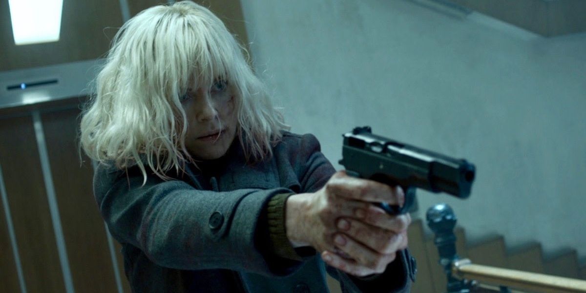 Charlize Theron pointing a gun in Atomic Blonde