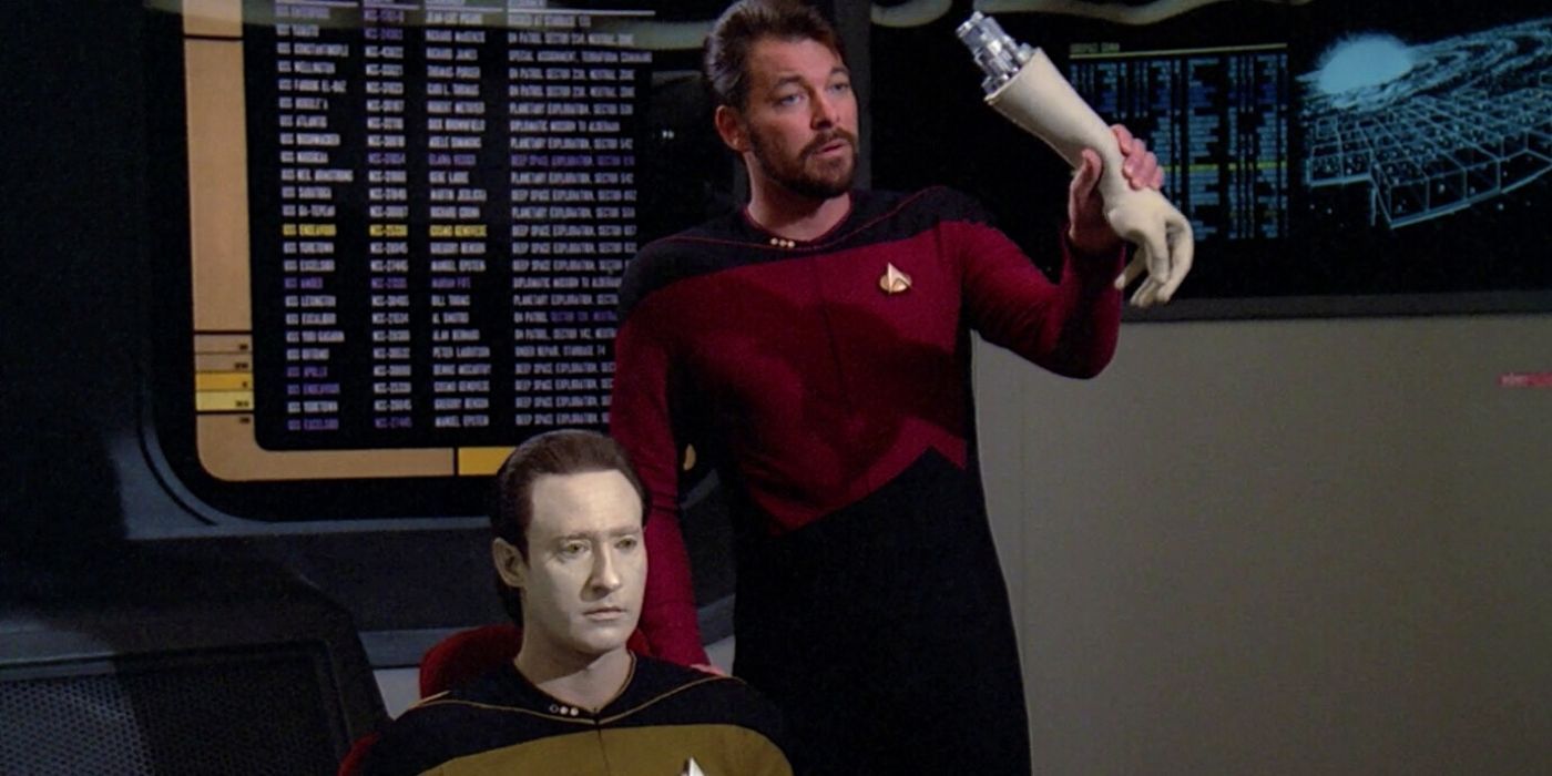 Riker holds up Data's arm in TNG