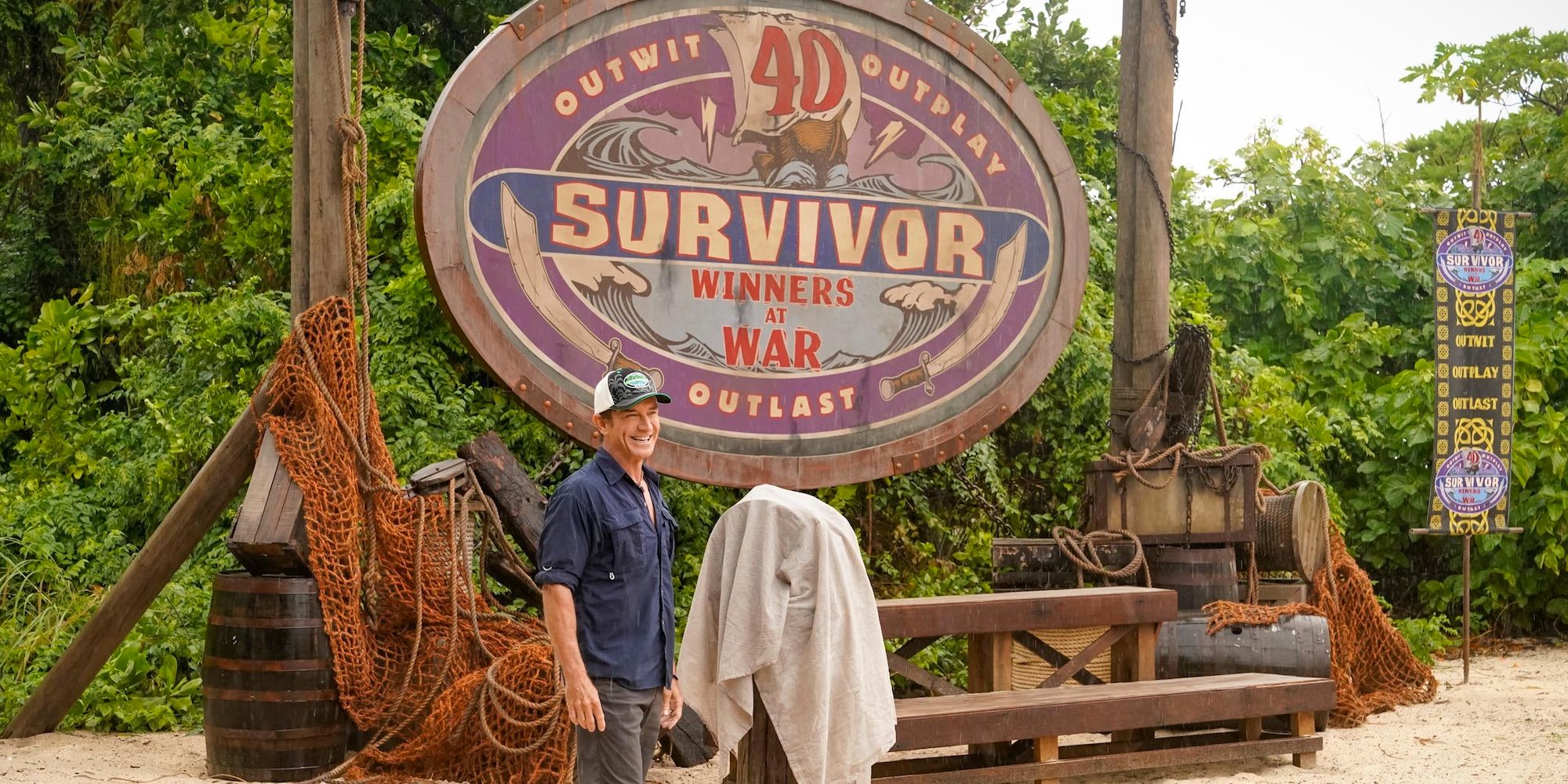 Jeff in front of the titular sign for Survivor