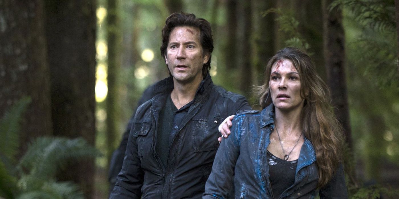 The 100 Kane and Abby in the woods