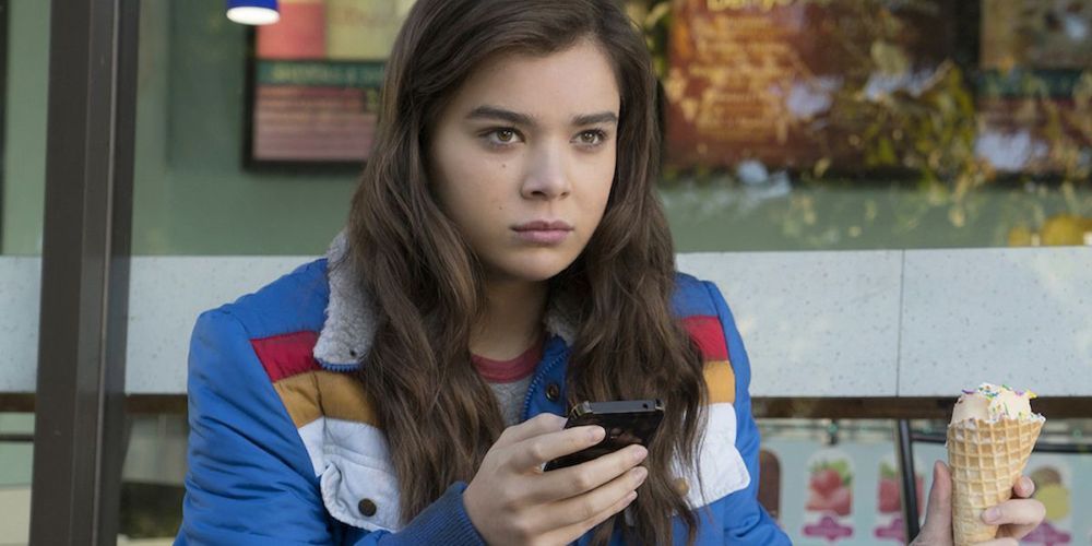 Nadine sitting outside looking serious in The Edge of Seventeen