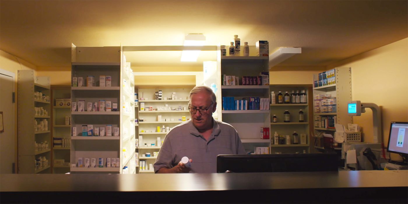 The Pharmacist at a counter in The Pharmacist