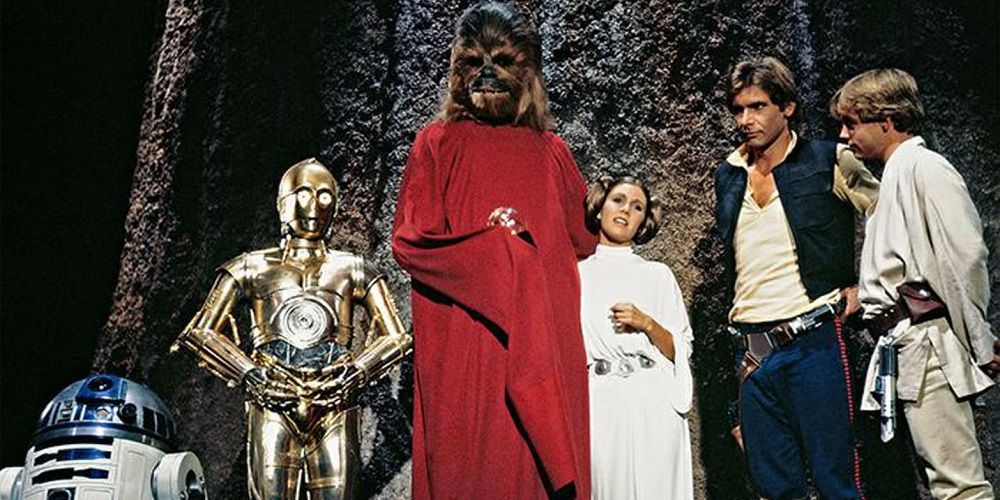 R2-D2, C3-PO, Chewbacca, Leia, Han, and Luke in the The Star Wars Holiday Special