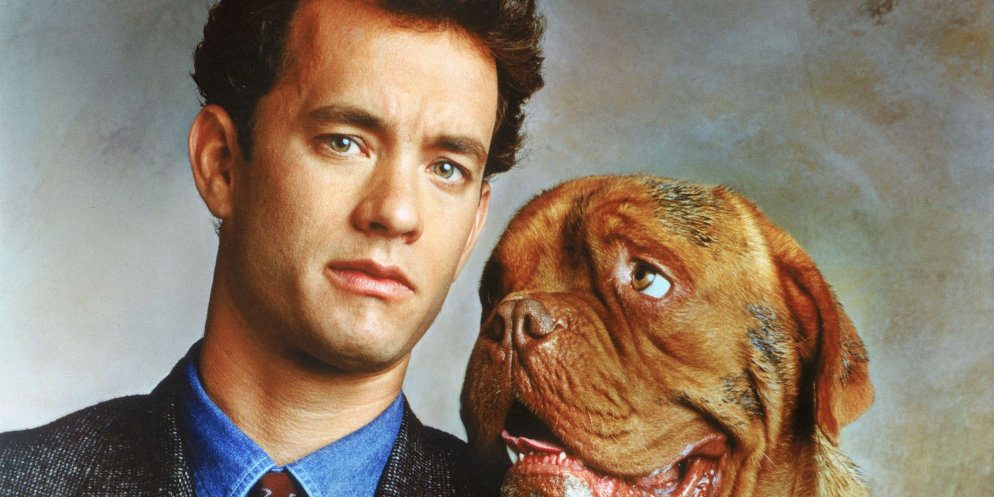 Tom Hanks and the dog looking at the camera in Turner and Hooch