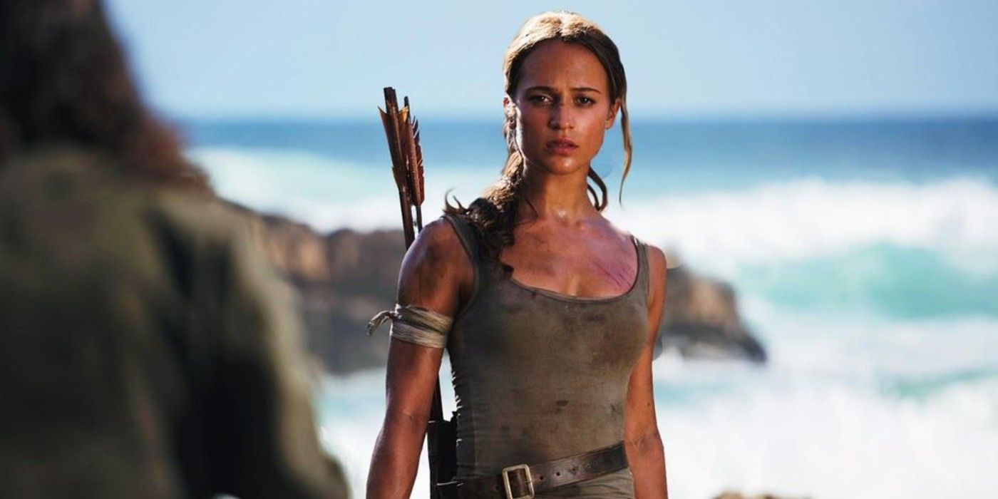 Lara Crofts stands on the beach in Tomb Raider.