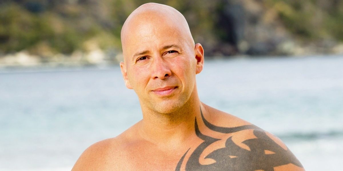 Tony Vlachos posing for a promo photo at the beach in The Challenge.